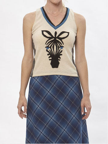 model Beige cashmere sweater vest with black zebra appliqué and contrast blue v-neck trim.