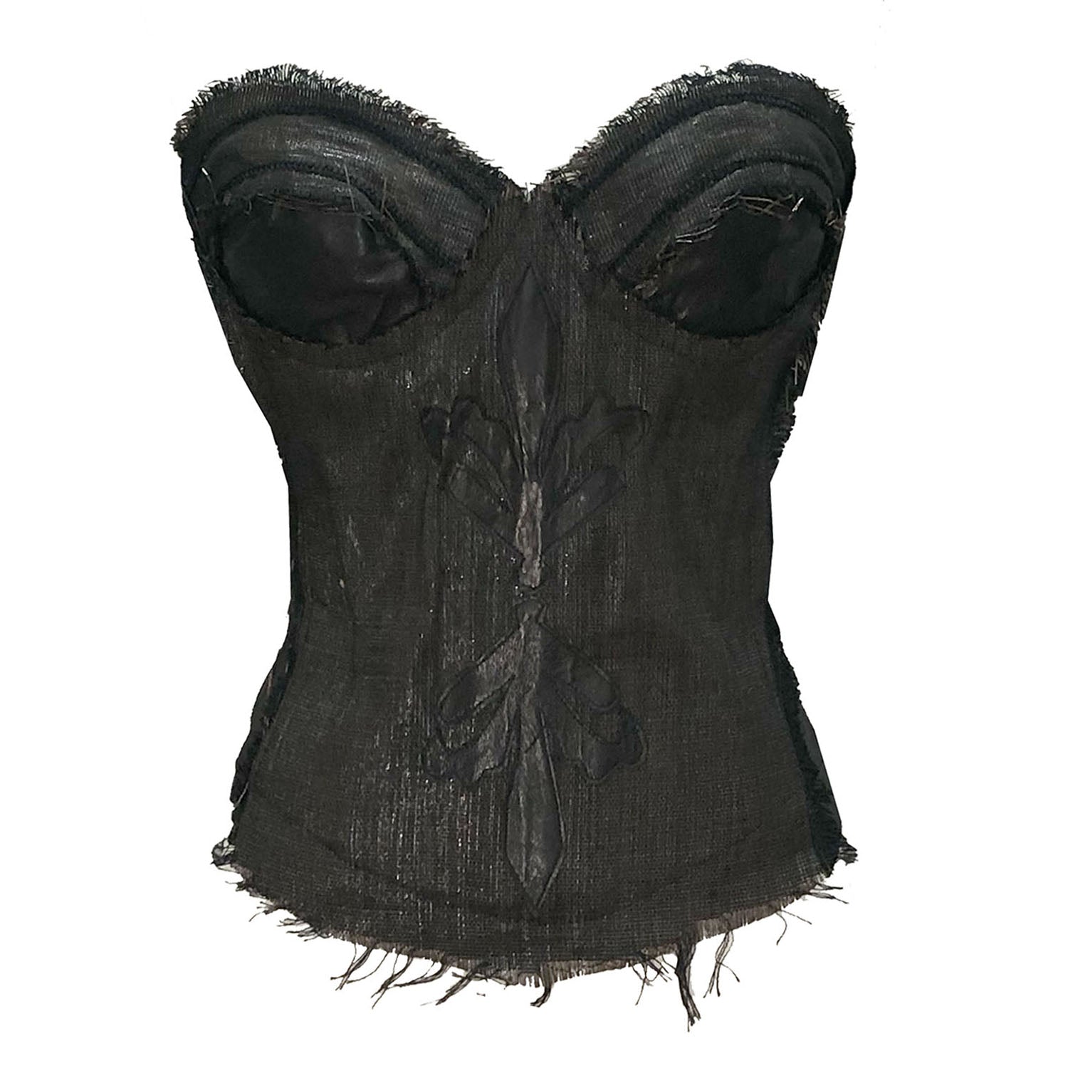 Steampunk-inspired black bustier made from recycled cassette tape fabric with leather appliqués and raw edge detailing.