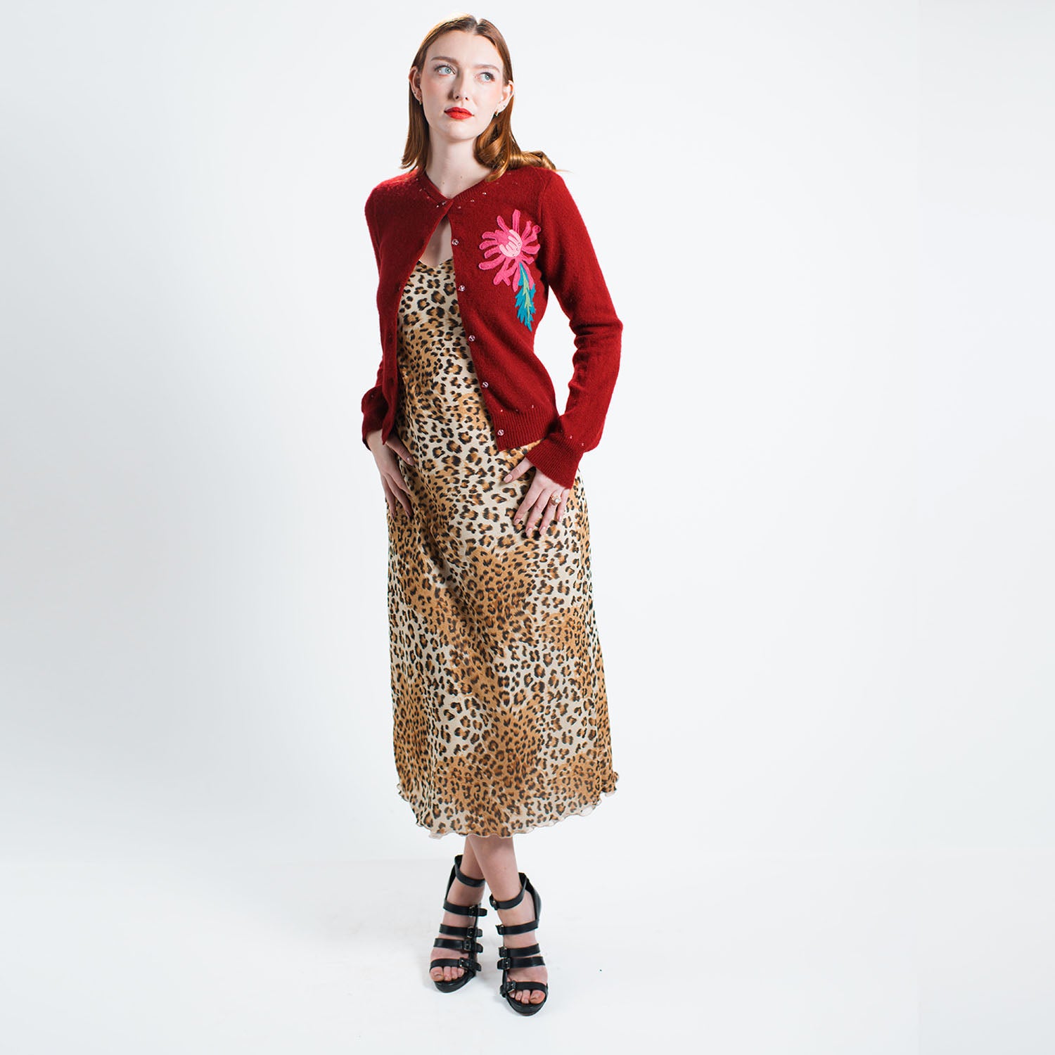 model-Leopard-print vegan rayon slip dress with adjustable straps, cotton voile lining, and bias-cut silhouette made from deadstock fabric. with the mums cardigan.