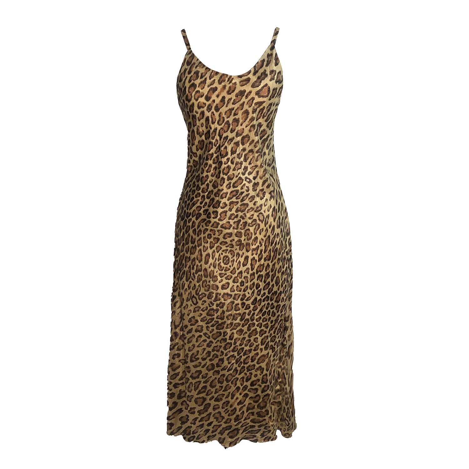 Leopard print silk slip dress with adjustable straps, bias-cut silhouette, and full lining, made from limited deadstock fabric.