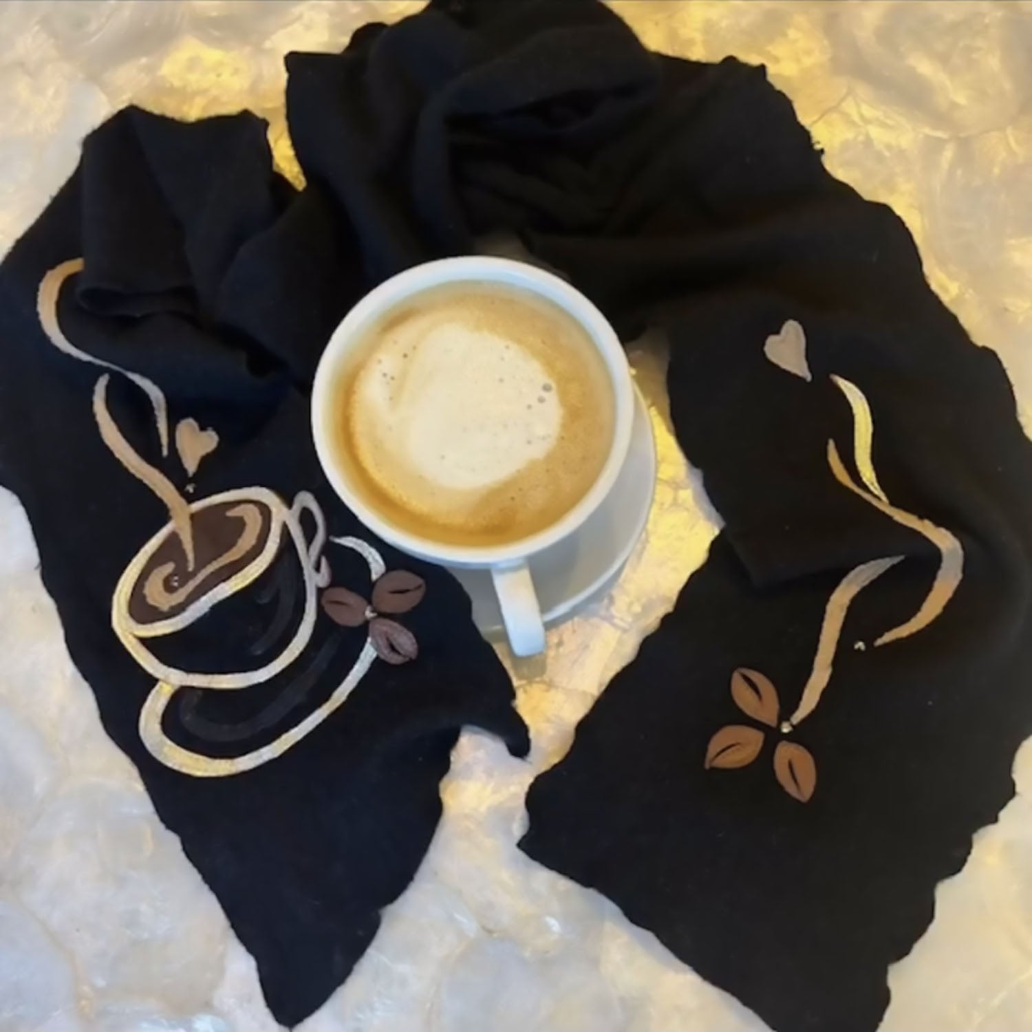 Coffee Cup Eco Scarf by Deborah Lindquist – black cashmere scarf with appliqué coffee cup, leaves, and steam in vintage leather