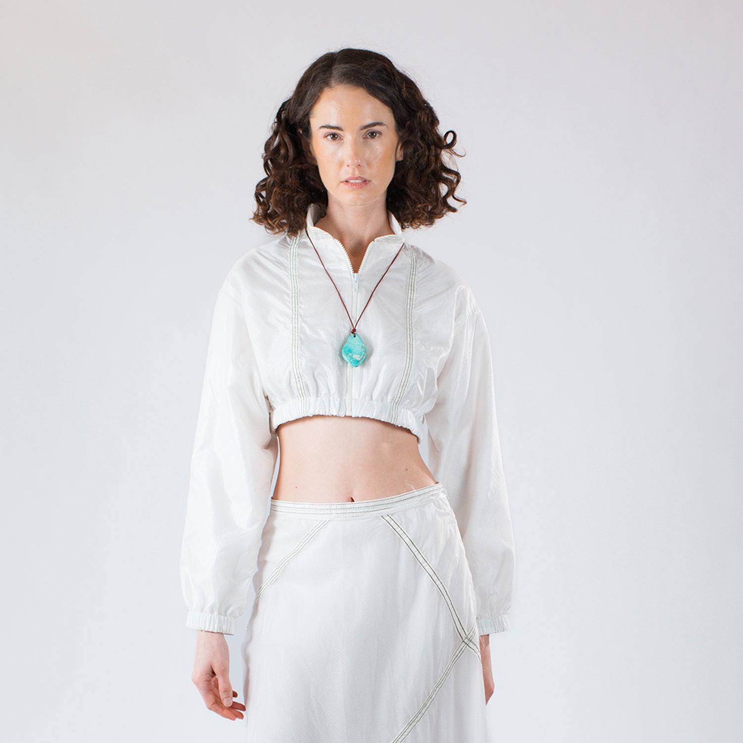 Blanche bomber jacket in upcycled parachute nylon with mandarin collar and structured silhouette.