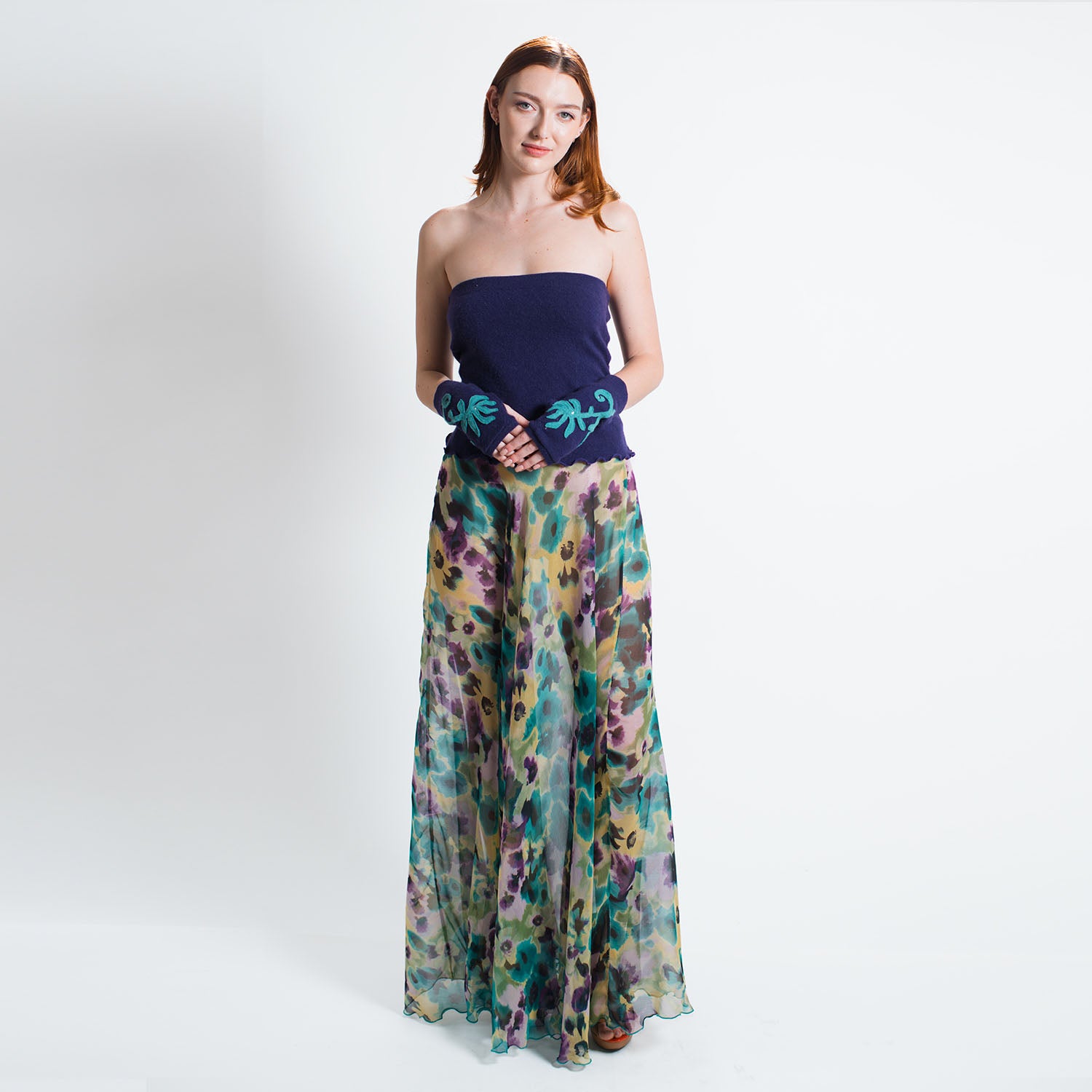 model in Faelyn Skirt in Monet-inspired multicolor silk chiffon, full-length with flowing maxi silhouette with tube top and gloves.