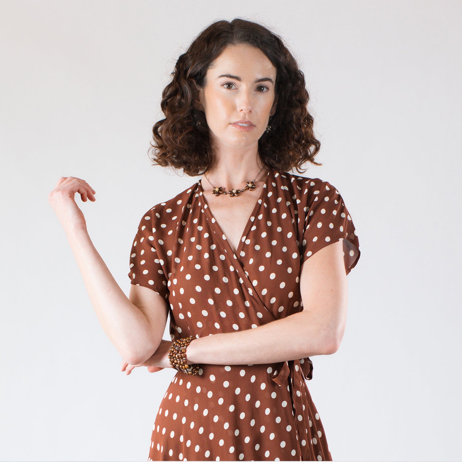 model in bronze floral necklace with matching earrings