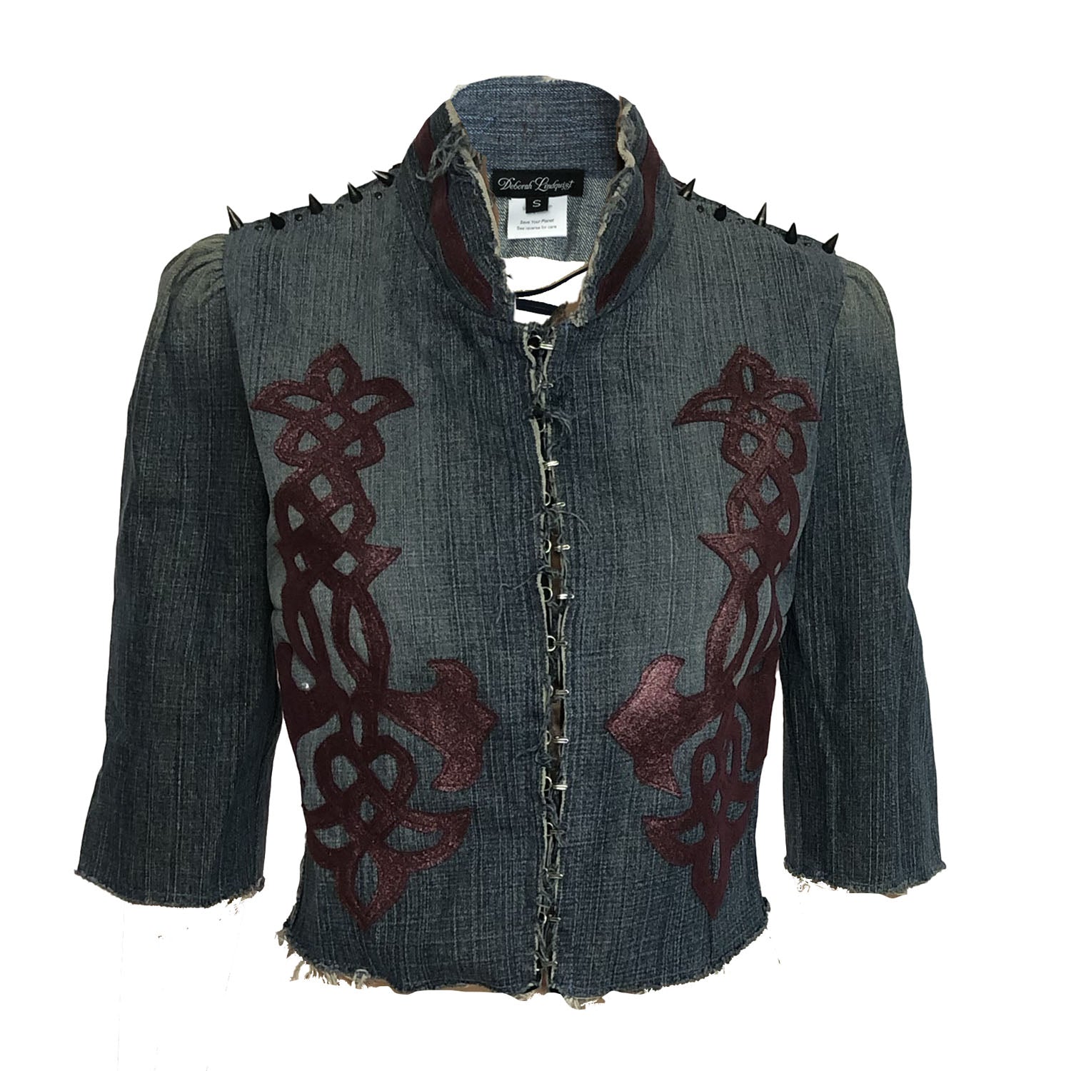 Gwendolyn Jacket – western-inspired cropped denim jacket with vintage leather appliqué, spike studs, and corset back, shown in dark upcycled wash.