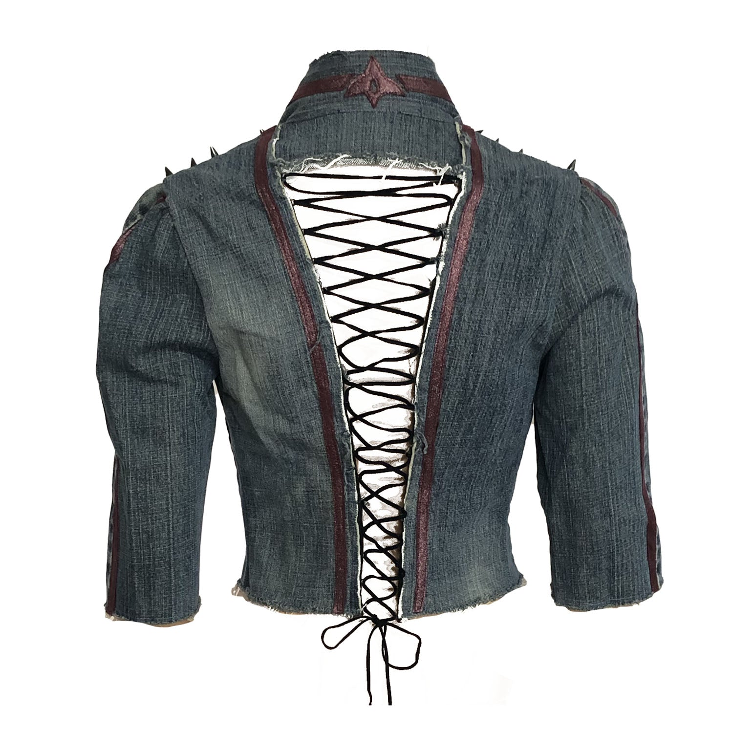Bacl Gwendolyn Jacket – western-inspired cropped denim jacket with vintage leather appliqué, spike studs, and corset back, shown in dark upcycled wash.