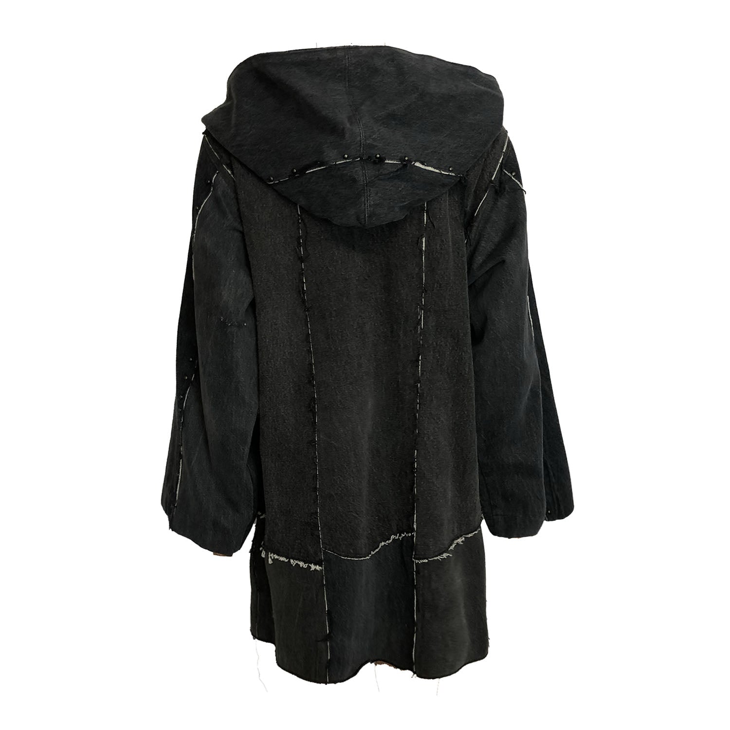 Oversized hooded black denim coat with raw-edge seams and a deconstructed silhouette.