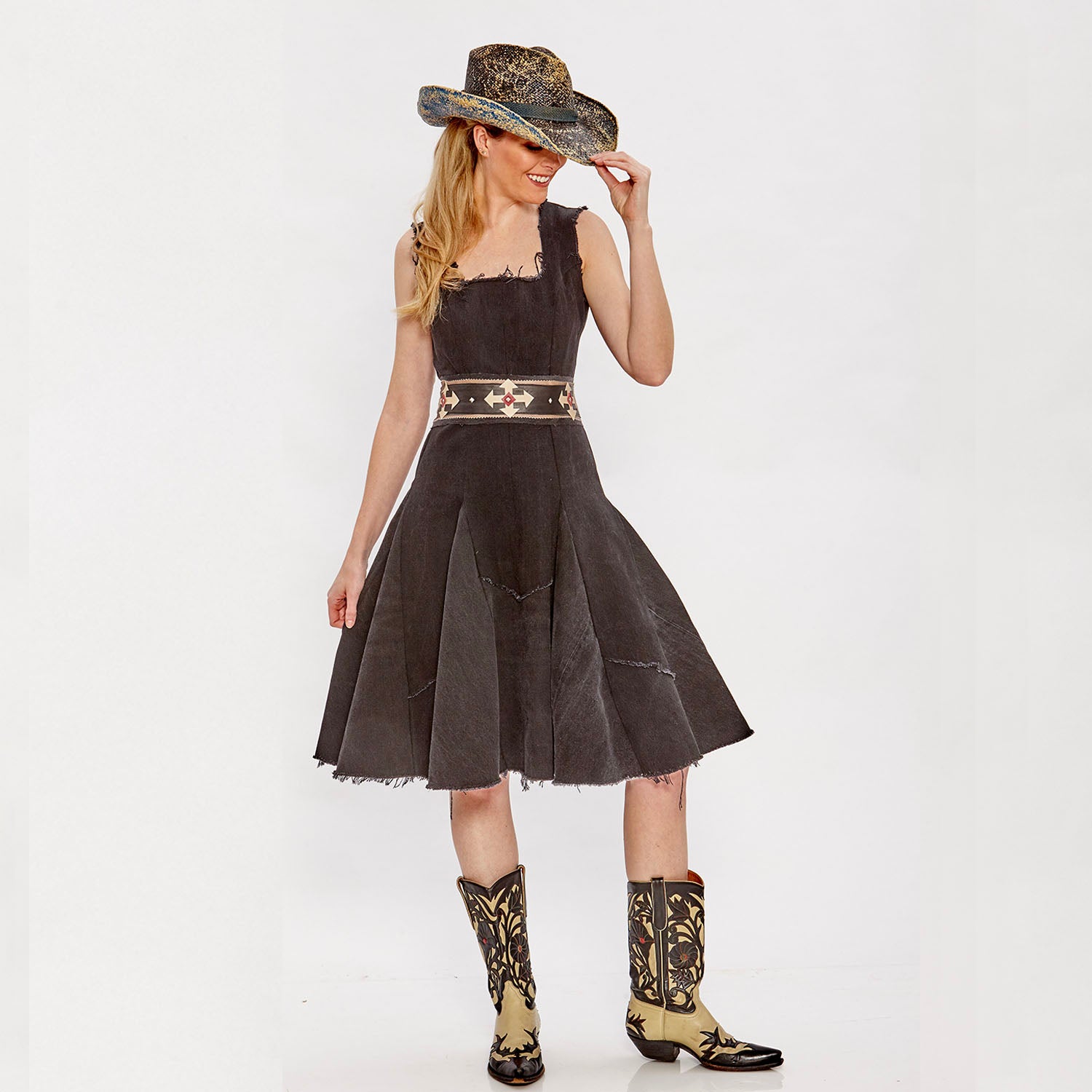 Lucy Dress – black upcycled denim fit-and-flare dress with raw-edged hem and exposed back zipper, sleeveless and paneled.