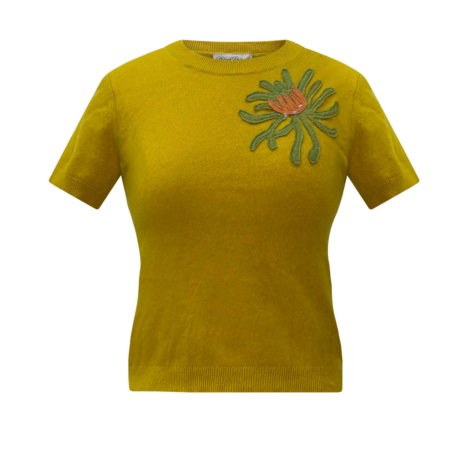 Mustard yellow cashmere short-sleeve sweater with green and coral chrysanthemum corsage appliqué at the shoulder.