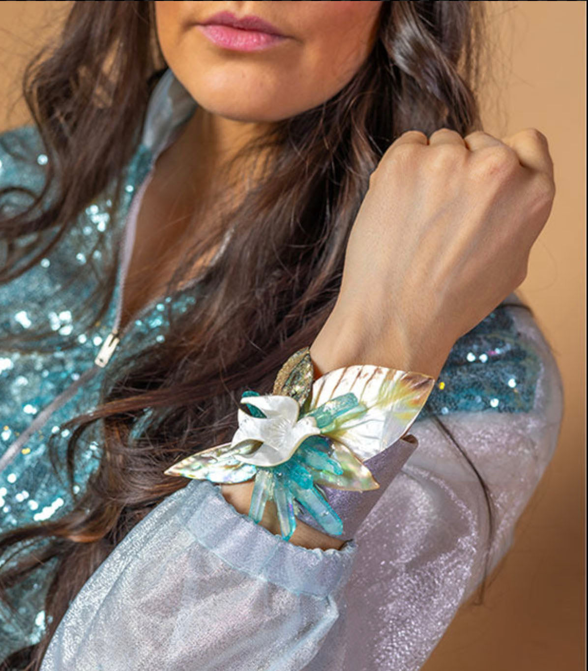 model in Peace Dove cuff with mother-of-pearl and iridescent shell leaves