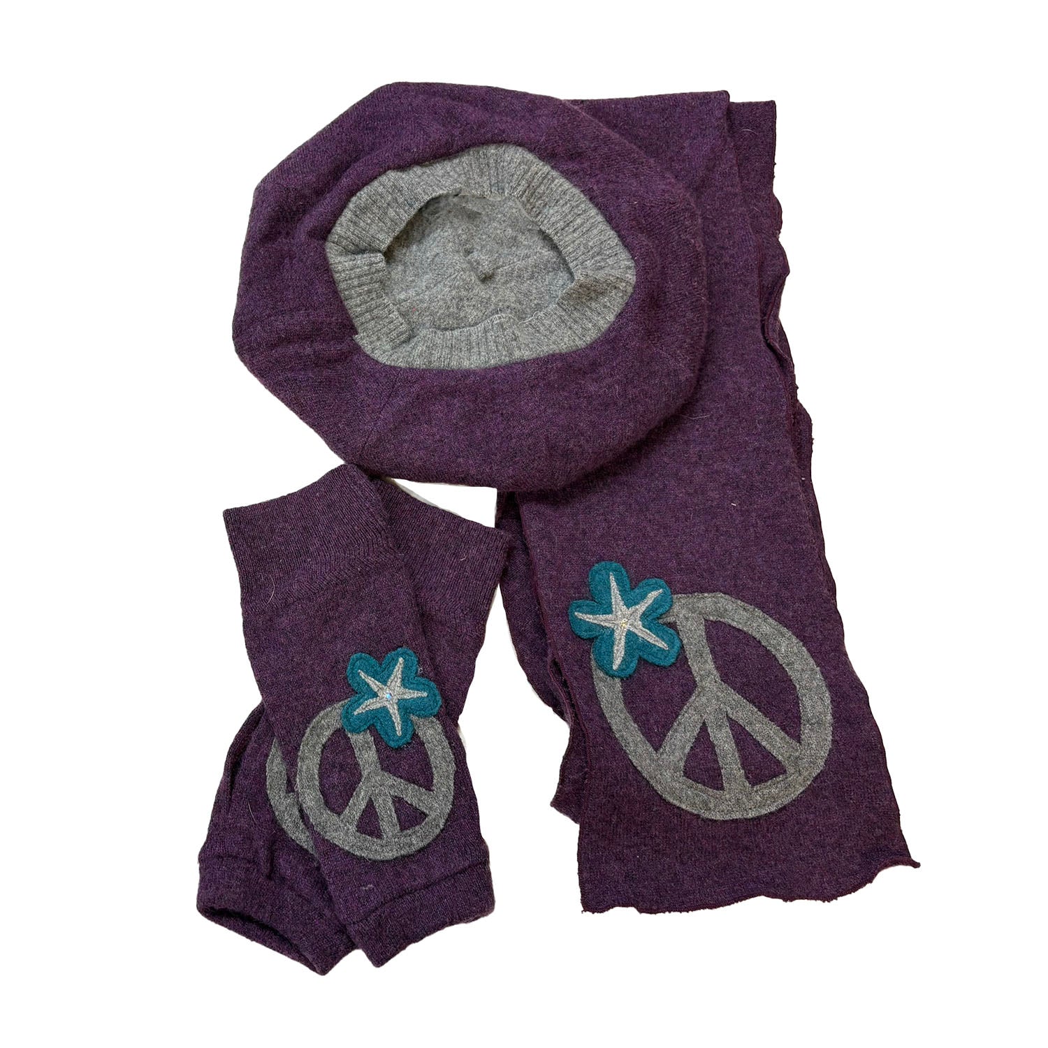 Matching deep purple cashmere scarf, fingerless gloves, and reversible beret with grey peace sign appliqués and floral accents.