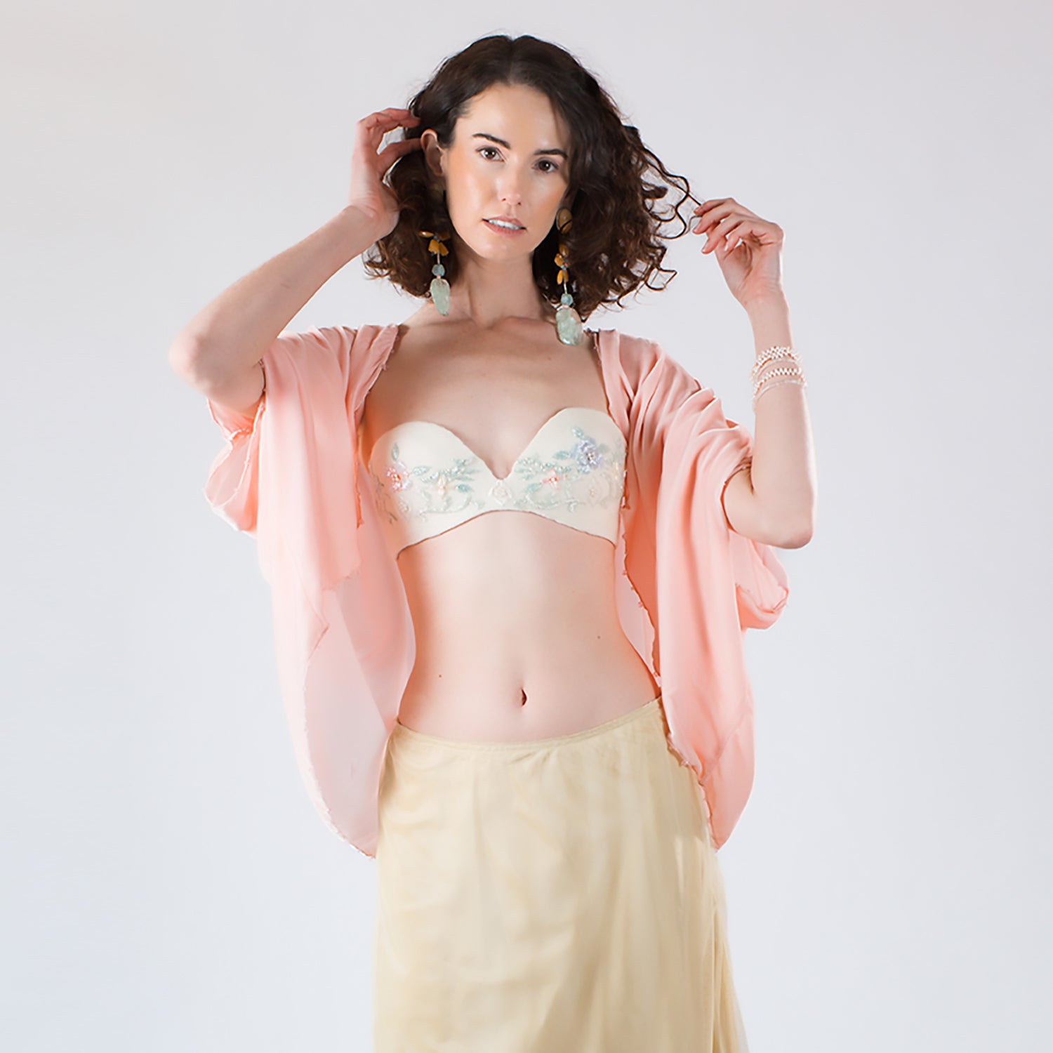model in pink velvet shrug with crystal beaded edge