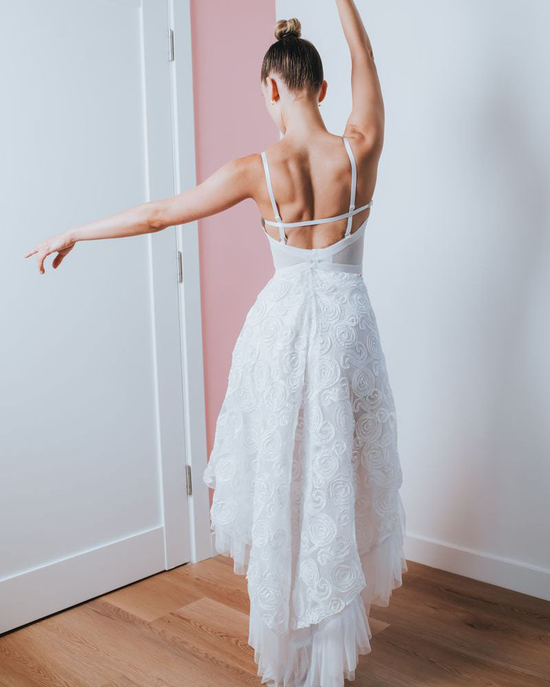 back Romantic rosette bustier with ribbon floral bodice, sheer panels, and rhinestone embellishment. Perfect for bridal or special occasion wear. Made to order.