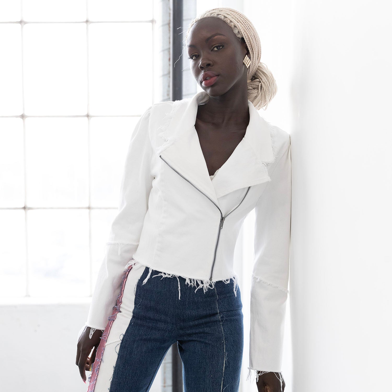 White Angie Jacket – upcycled denim motorcycle jacket with raw edges and antique silver zipper, shown in white cotton denim.