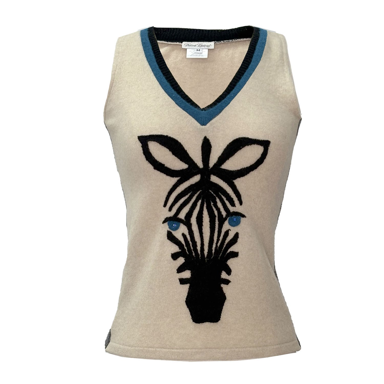 Beige cashmere sweater vest with black zebra appliqué and contrast blue v-neck trim.
