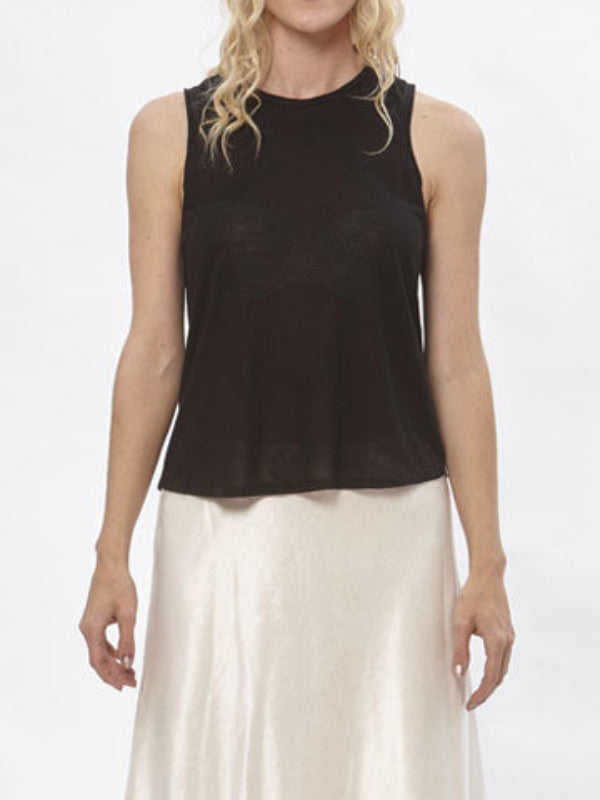 Alt Text:
Model wearing black sleeveless modal Taylor T Shirt paired with champagne-colored silk/hemp skirt against a white backdrop.