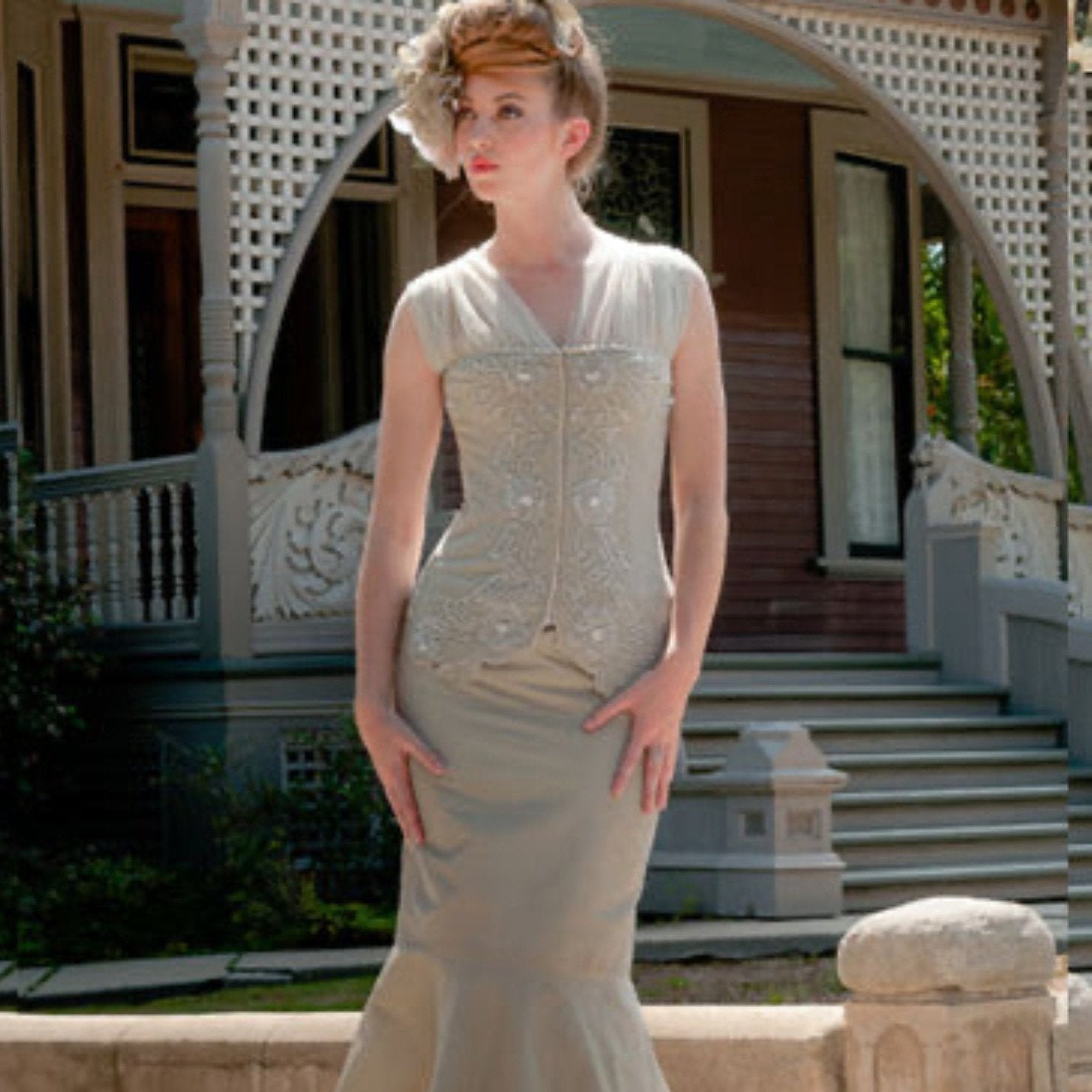 Eunice bustier model Vintage grey beaded wool bustier with front hook closure and corseted back, long line silhouette.