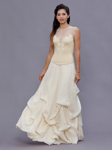 Model wearing the Janice Bustier, a vintage beaded wool bustier with pearl detailing and halter tie, paired with a linen bustle skirt.