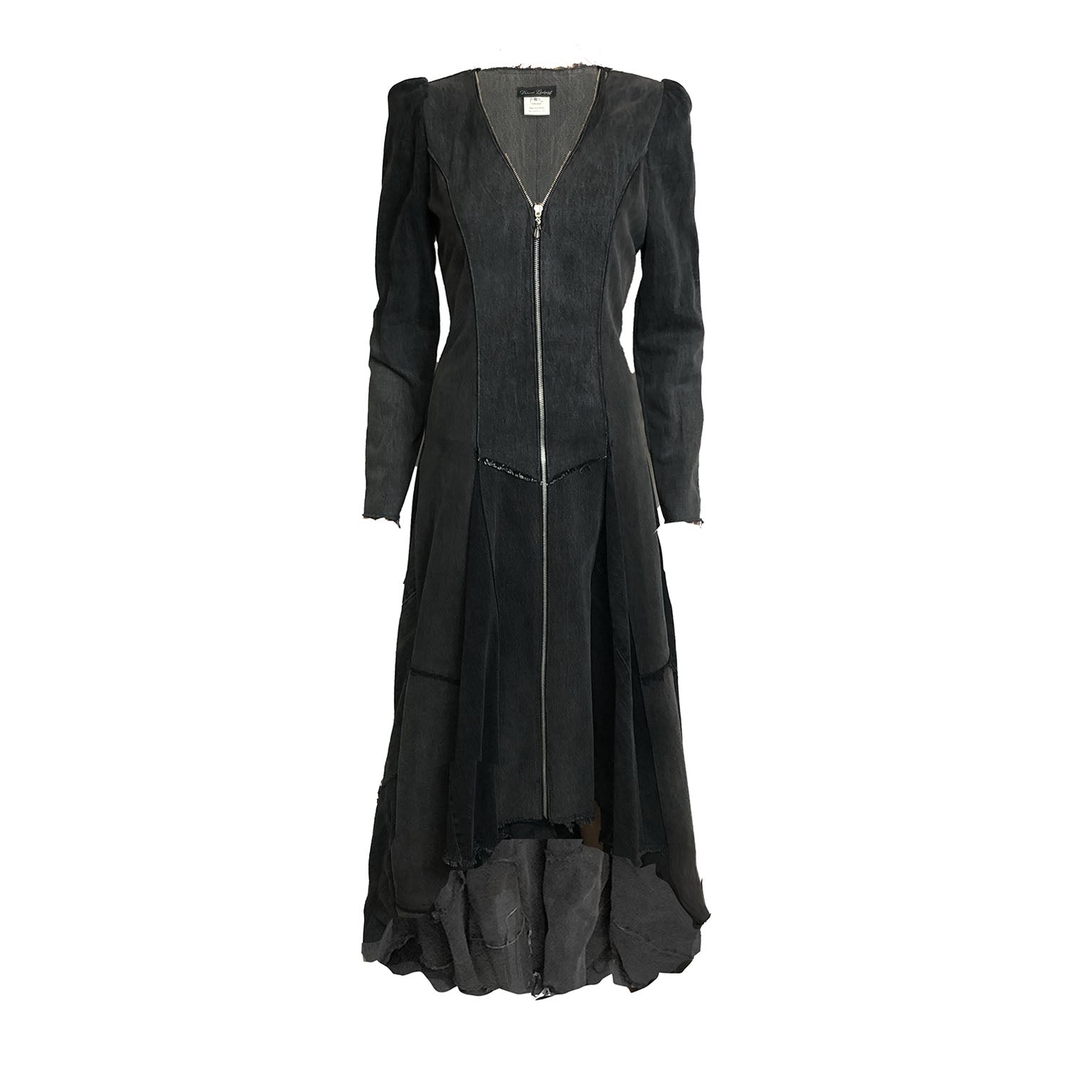 Front view of the Beatrix Coat in distressed black upcycled denim featuring a high-low hem, raw edges, V-neckline, and exposed double zipper closure.