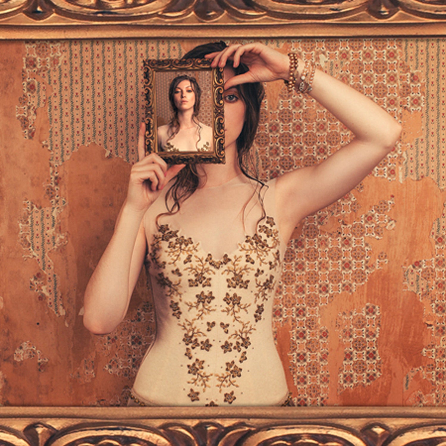 Vintage ivory wool bustier with bronze floral beading and illusion neckline.