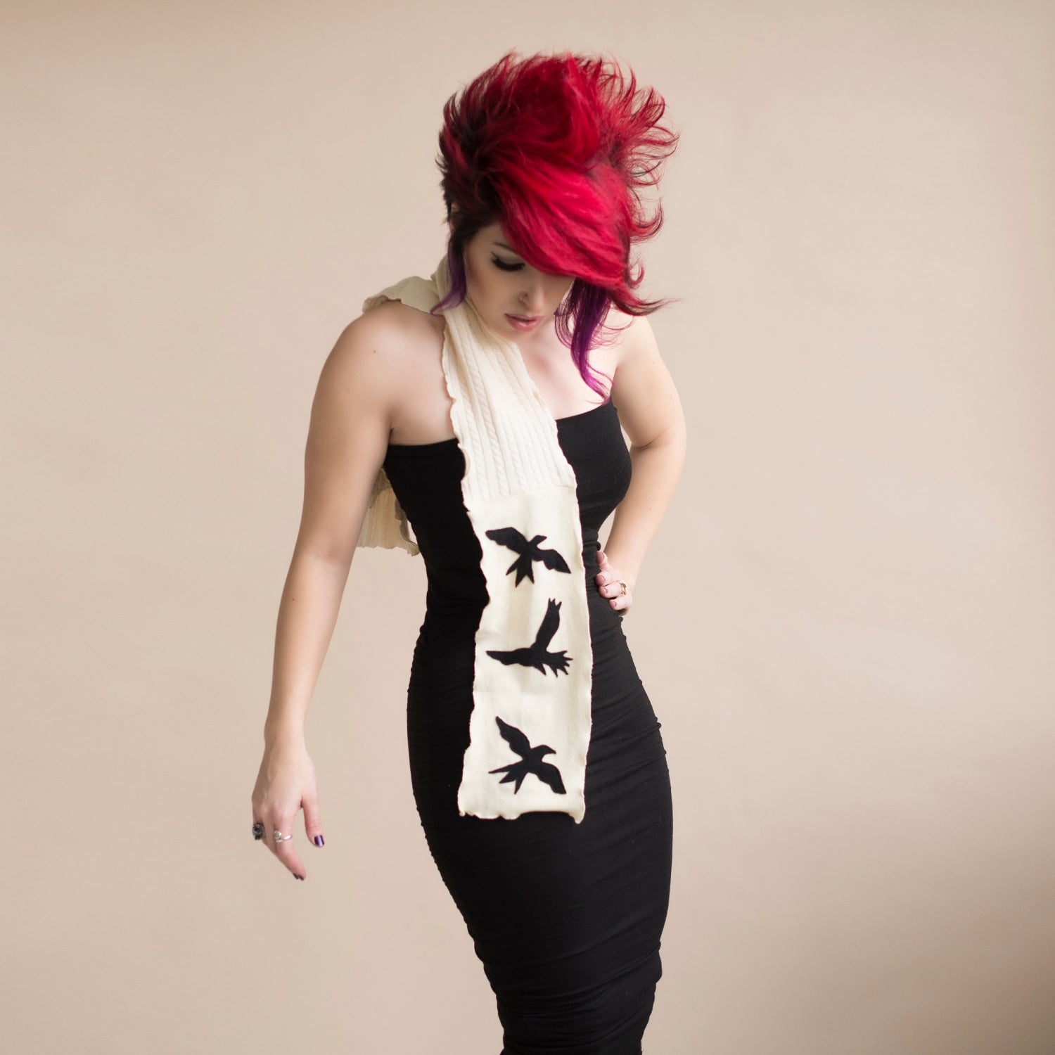 A striking reincarnated cashmere scarf with black bird appliqués on ivory.