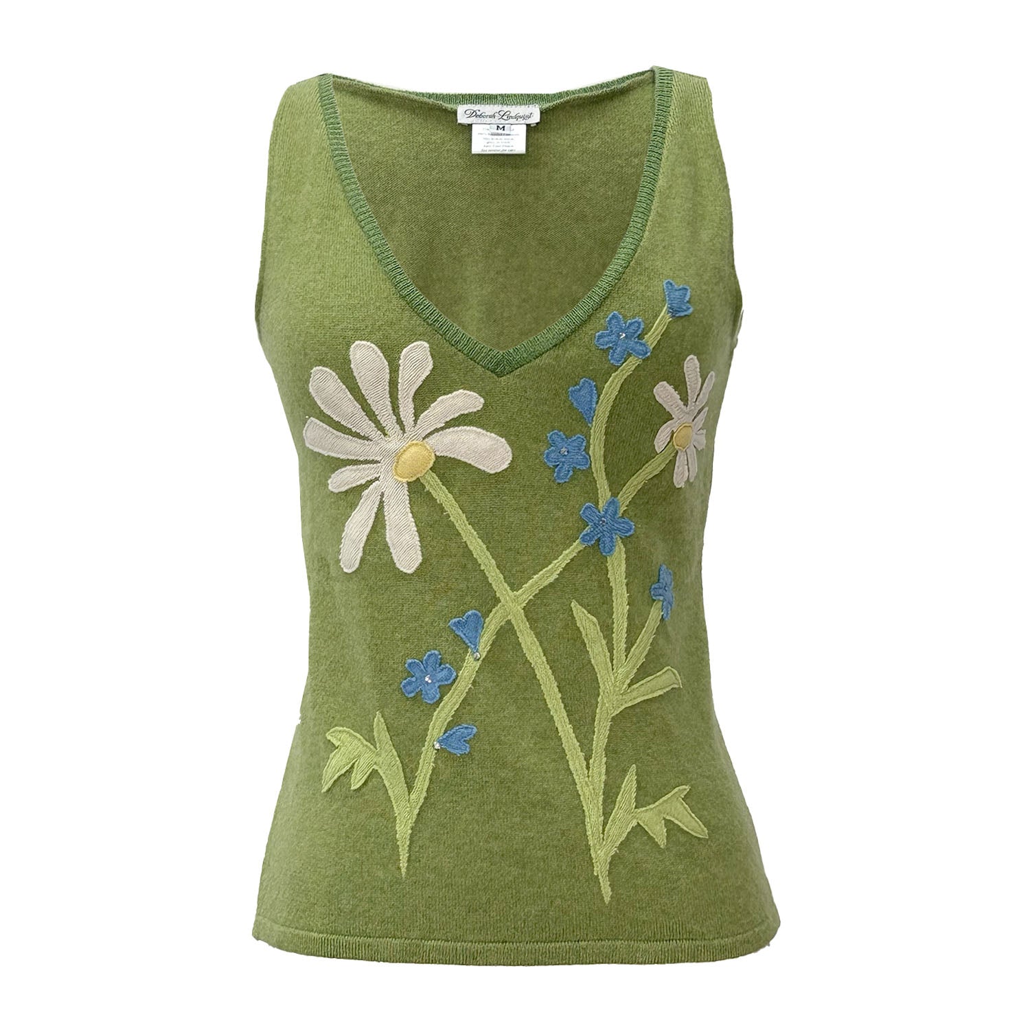 Green v-neck upcycled cashmere sweater vest with white daisy and blue flower appliqué design on front.