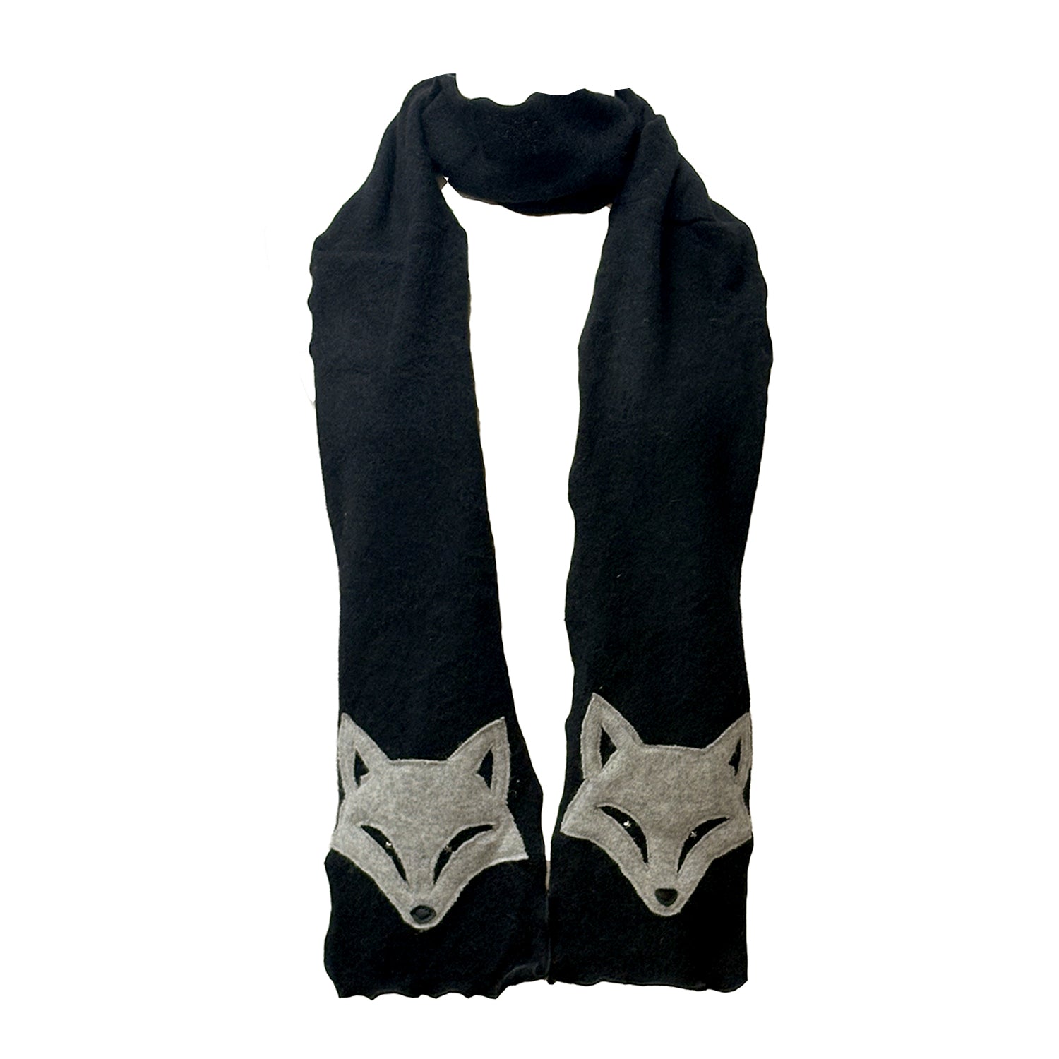A reincarnated cashmere scarf featuring pale grey fox appliqués on black. 