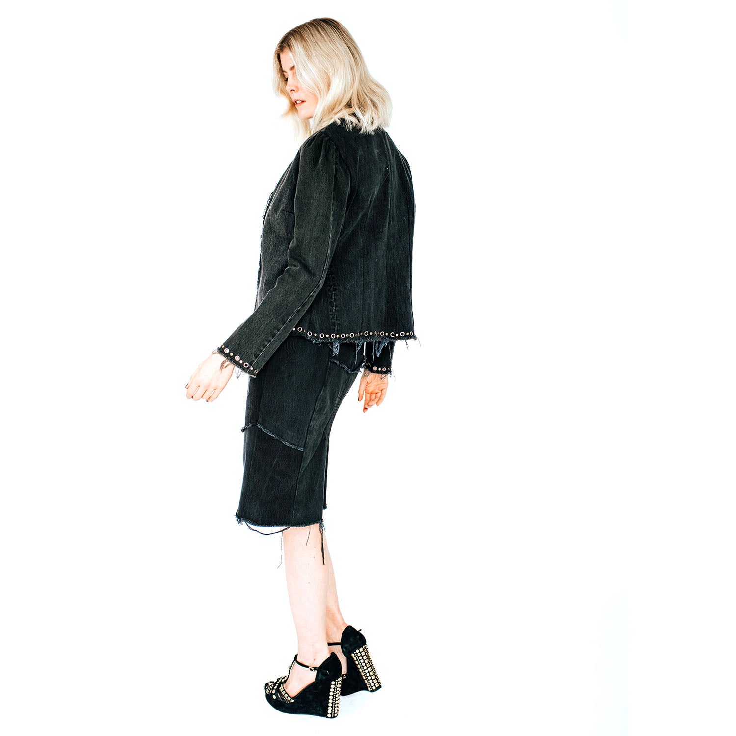 Model wearing the Galena Jacket in studded black denim with mandarin collar and hook closure