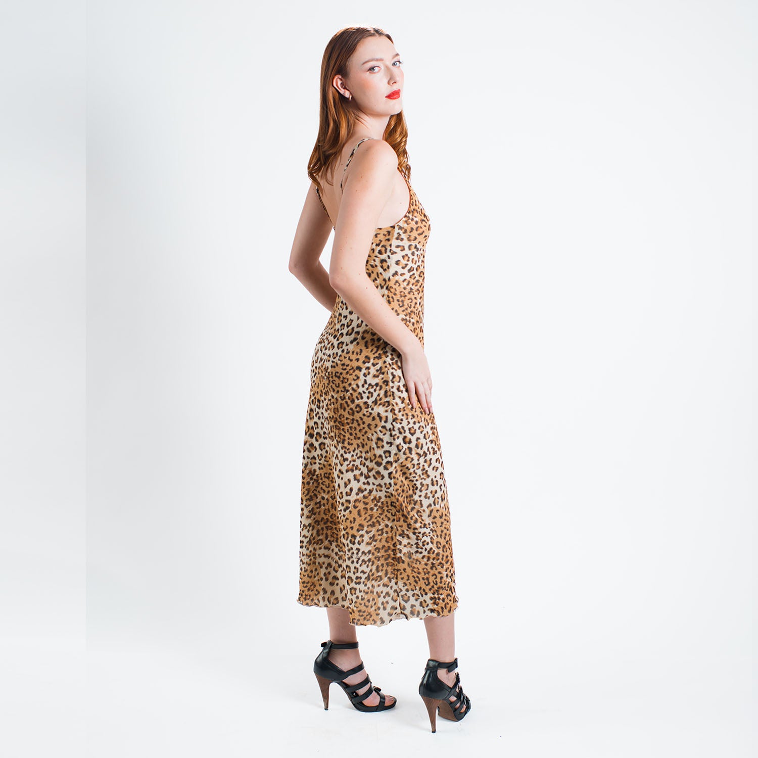 model-Leopard-print vegan rayon slip dress with adjustable straps, cotton voile lining, and bias-cut silhouette made from deadstock fabric.
