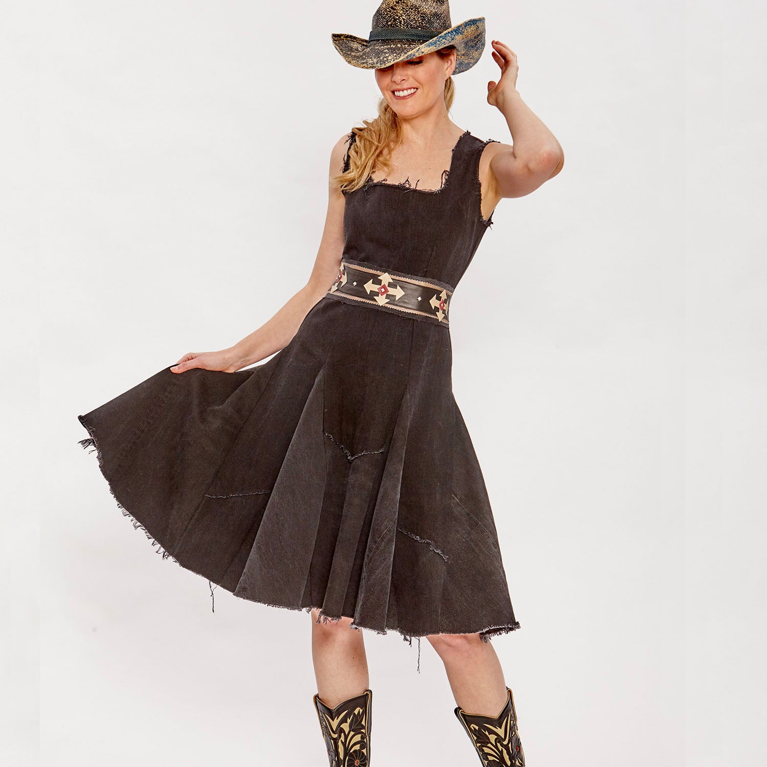 Lucy Dress – black upcycled denim fit-and-flare dress with raw-edged hem and exposed back zipper, sleeveless and paneled.