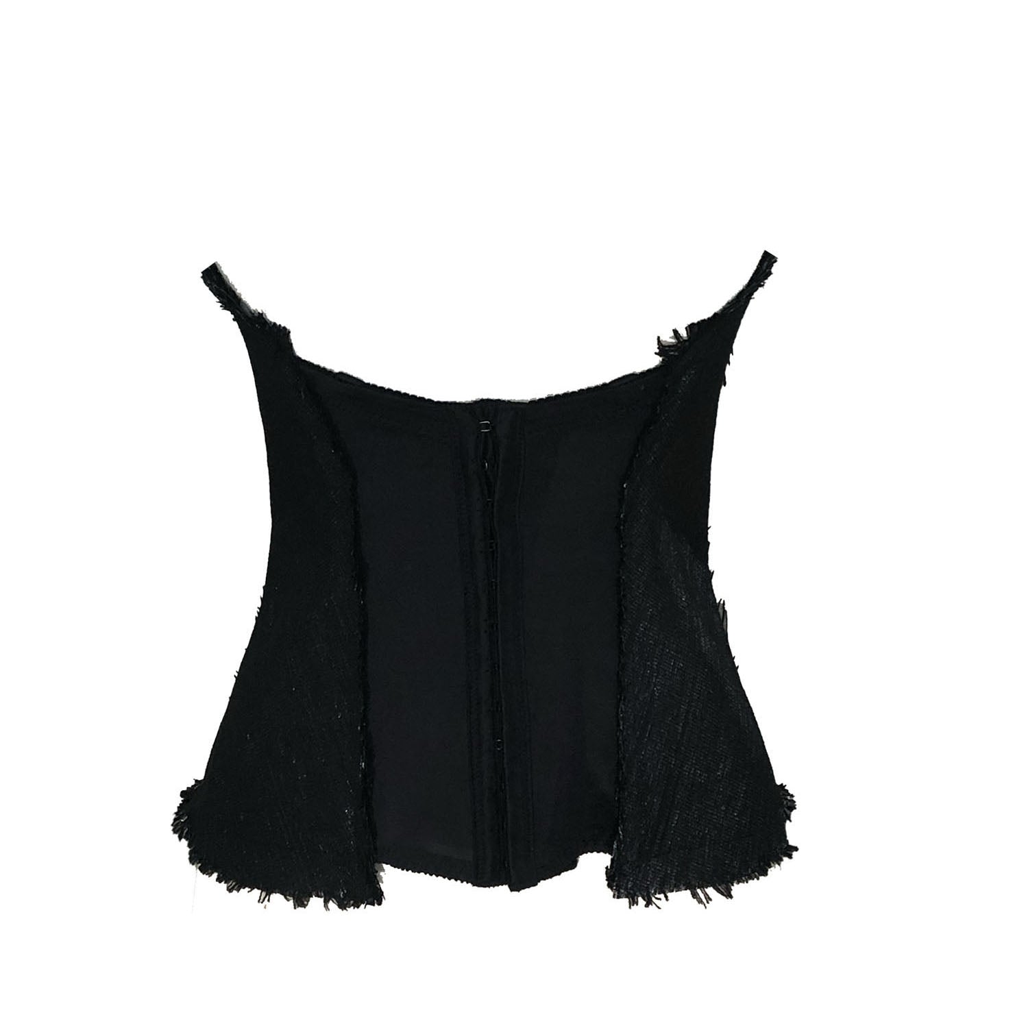 back Black strapless bustier made from recycled cassette tape fabric, featuring leather appliqués, a front zipper, and eco-conscious steampunk styling.