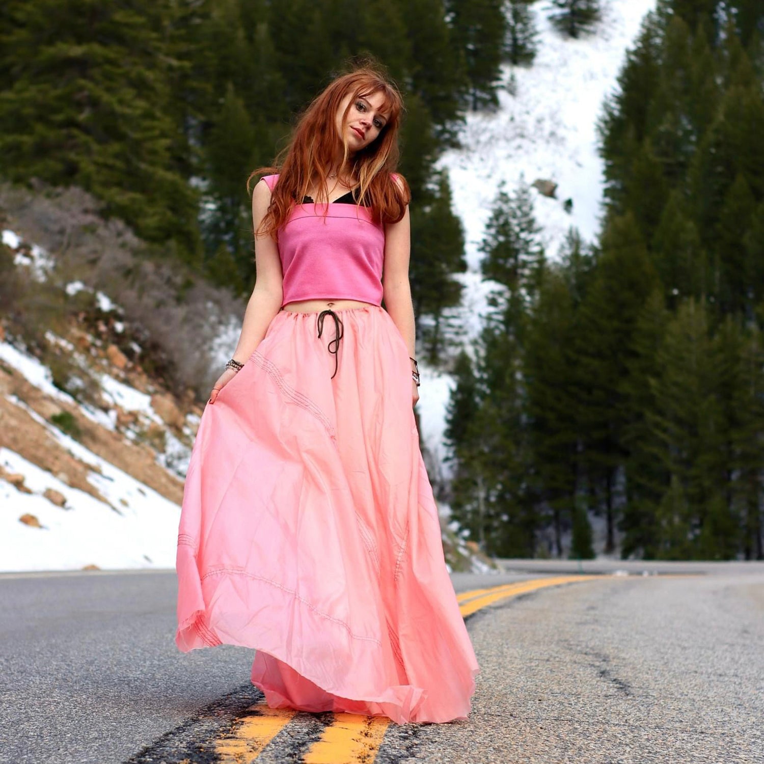 “Pink Amy Parachute Skirt, flowing drawstring-waist skirt made from upcycled nylon parachute, hand-dyed in a rare rosy hue”