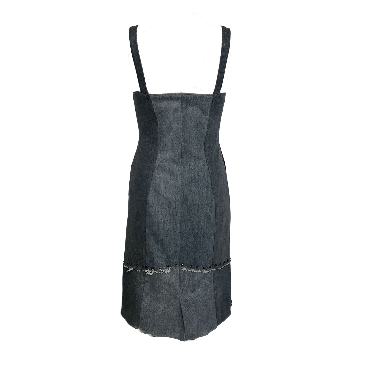 Distressed black fitted sheath dress made from upcycled denim with front zipper, raw edges, princess seam zippers, and studded hem.