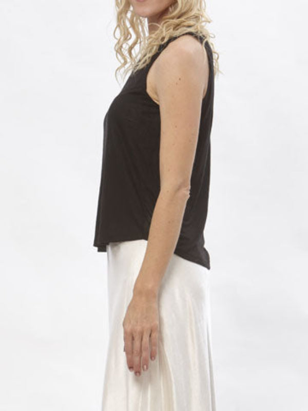 Alt Text:
Model wearing black sleeveless modal Taylor T Shirt paired with champagne-colored silk/hemp skirt against a white backdrop.