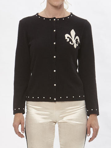 model Black reincarnated cashmere cardigan with Fleur de Lys appliqué and pearl stud embellishments, handmade from upcycled sweaters.