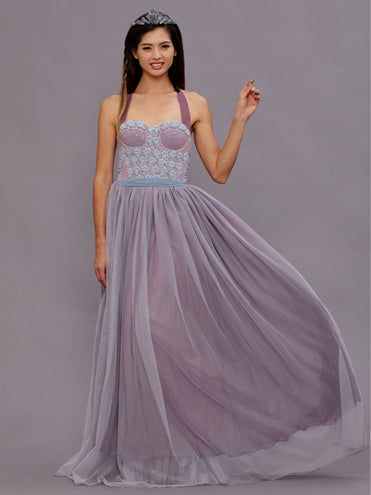 Model wearing the Ava Lavender Beaded Gown featuring a vintage beaded wool bodice, pale blue pearl accents, and a gathered English net skirt in a soft dusty mauve hue.