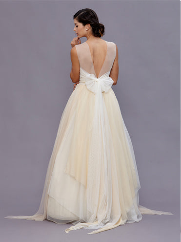 back model Beulah Ivory vintage beaded wool bustier with pearl waist detailing, illusion neckline, and English net bow train.