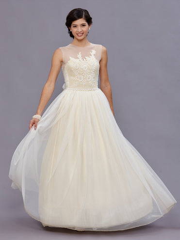 model Beulah Ivory vintage beaded wool bustier with pearl waist detailing, illusion neckline, and English net bow train.