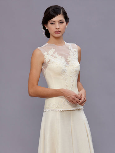 model Long vintage beaded wool bustier with illusion neckline and pearl hand beading by Deborah Lindquist.