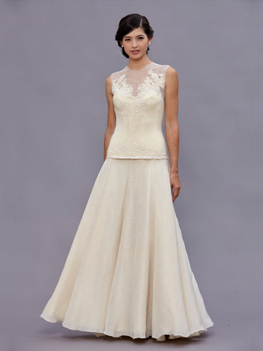 model Long vintage beaded wool bustier with illusion neckline and pearl hand beading by Deborah Lindquist.