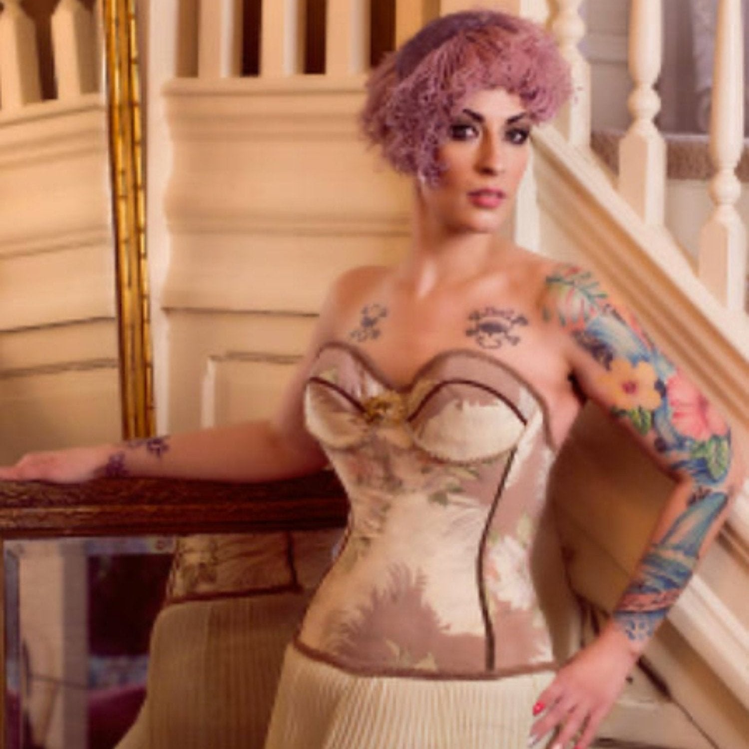 model Vintage bustier with 1940s feather and rose print in soft earth tones and braided trim detailing.